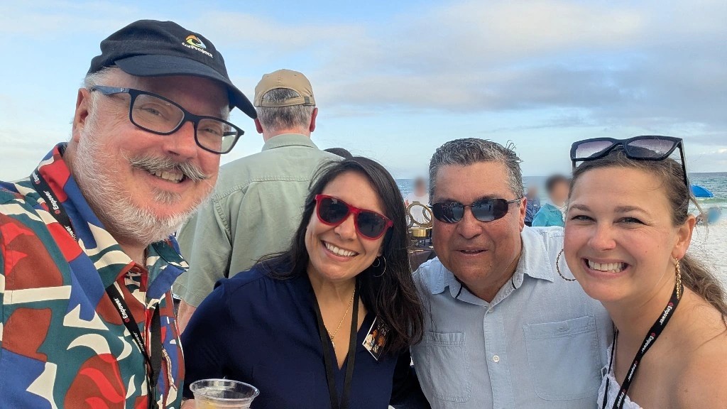 forProject's Chet Farmer with three friends at the EUG 2026 beach dinner in Sandestin, Florida